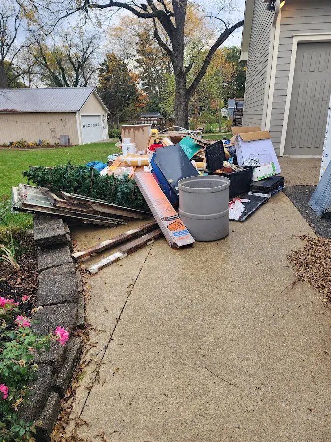Dumpster being loaded with debris for 12 Yard Dumpster Rental in Vallejo